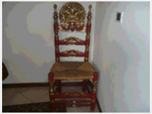 Sedia antica intarsiata con seduta impagliata
